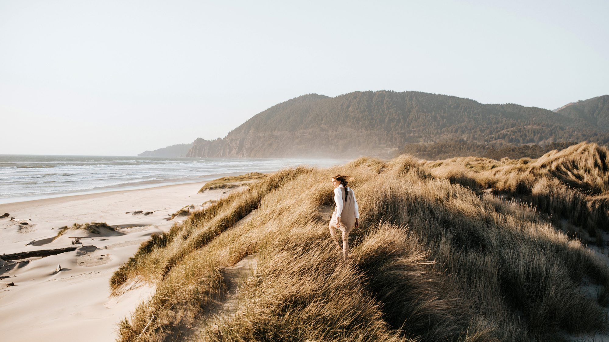 [PWM] Woman in dune grass in coastal setting